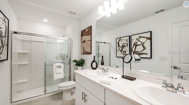 full bath featuring a sink, visible vents, toilet, and a shower stall