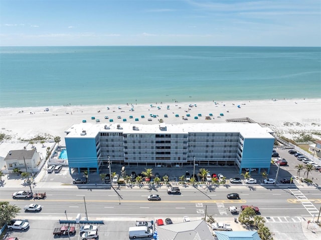 aerial view featuring a water view and a beach view