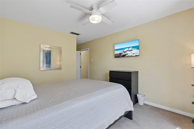 carpeted bedroom featuring baseboards, visible vents, and ceiling fan