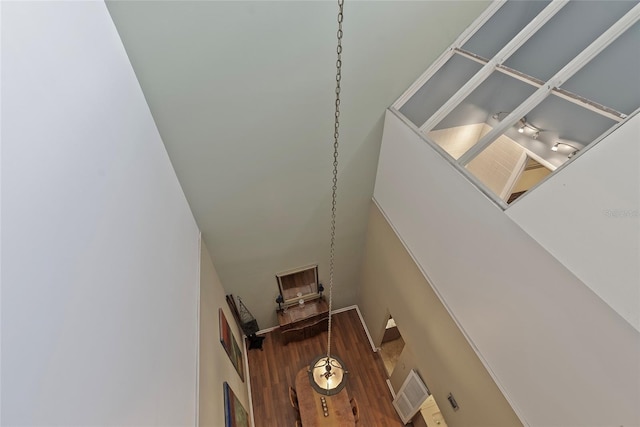 stairway featuring wood finished floors