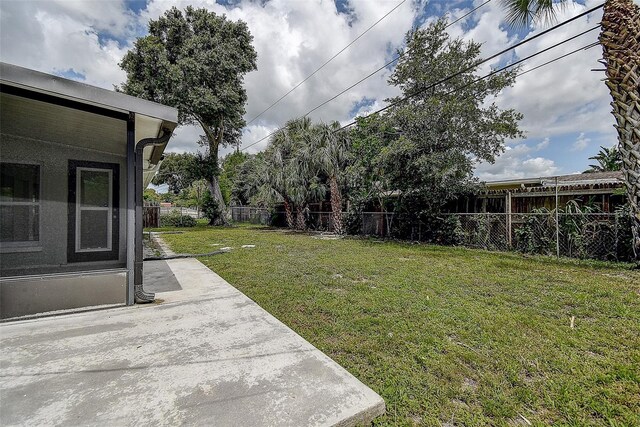 view of yard featuring a patio area and a fenced backyard