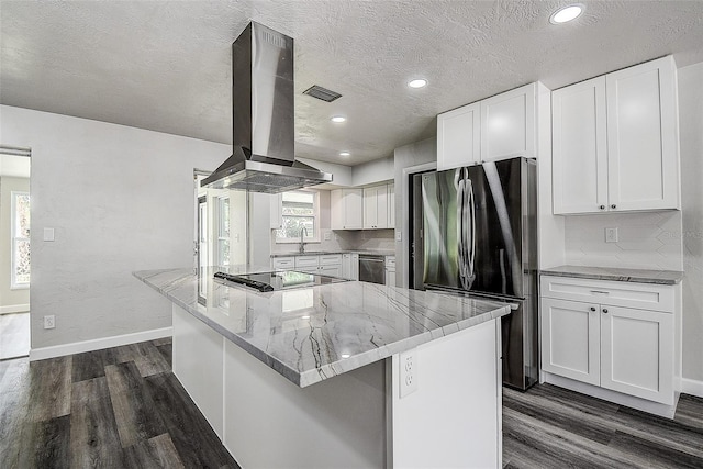 kitchen with dark wood-style floors, visible vents, a sink, appliances with stainless steel finishes, and island range hood