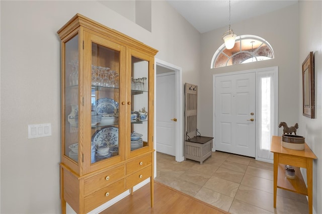 entryway featuring light tile patterned flooring