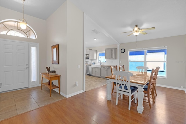 dining room with visible vents, a healthy amount of sunlight, and light wood-style flooring