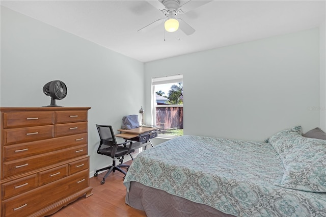 bedroom with ceiling fan and light wood-style floors