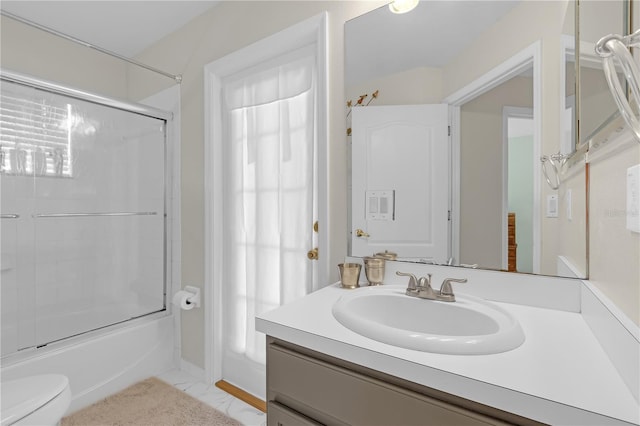 full bath featuring bath / shower combo with glass door, toilet, marble finish floor, and vanity