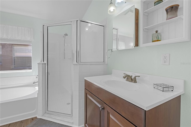 full bath featuring a bath, a shower stall, and vanity