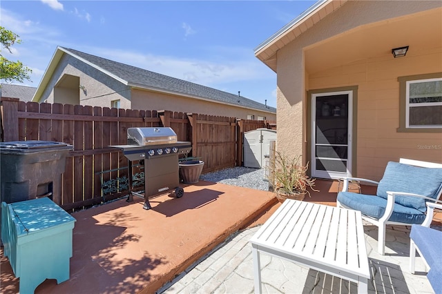 view of patio / terrace featuring fence and grilling area