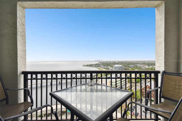 balcony featuring a water view