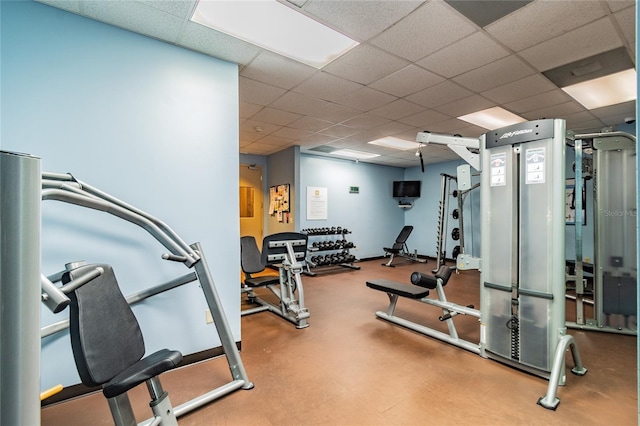 exercise room featuring a drop ceiling