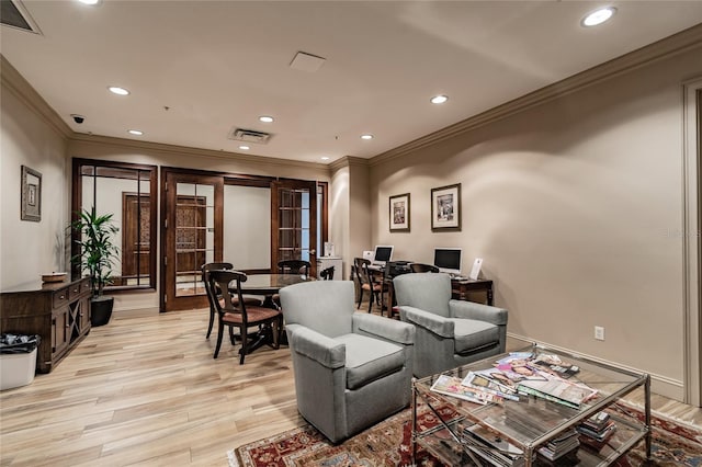 living room with visible vents, recessed lighting, french doors, and light wood-type flooring