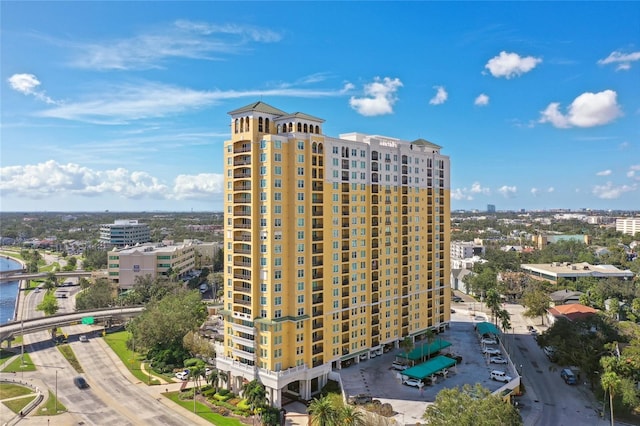 view of property featuring a water view and a city view