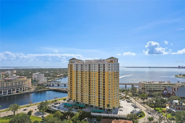 birds eye view of property with a view of city and a water view