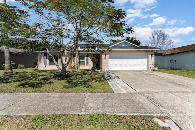 ranch-style house with brick siding, an attached garage, concrete driveway, and a front yard