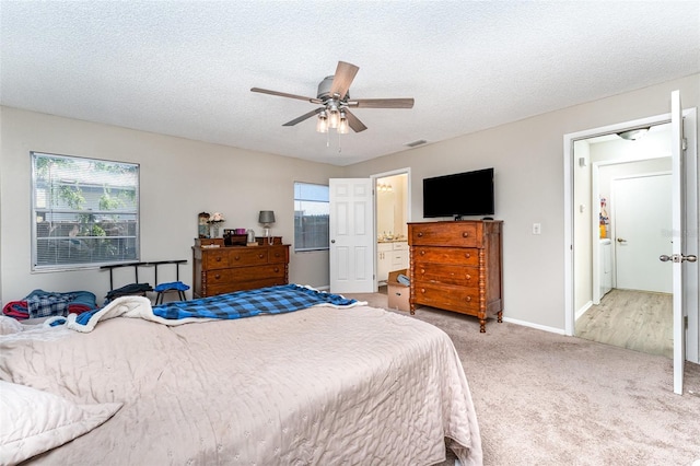 carpeted bedroom featuring visible vents, multiple windows, a textured ceiling, and ceiling fan