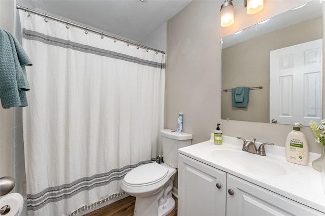 full bathroom featuring toilet, vanity, a shower with curtain, and wood finished floors