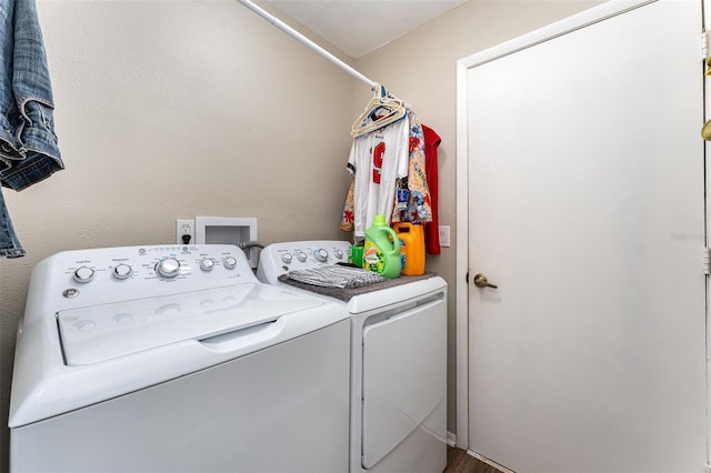 washroom featuring laundry area and washer and clothes dryer