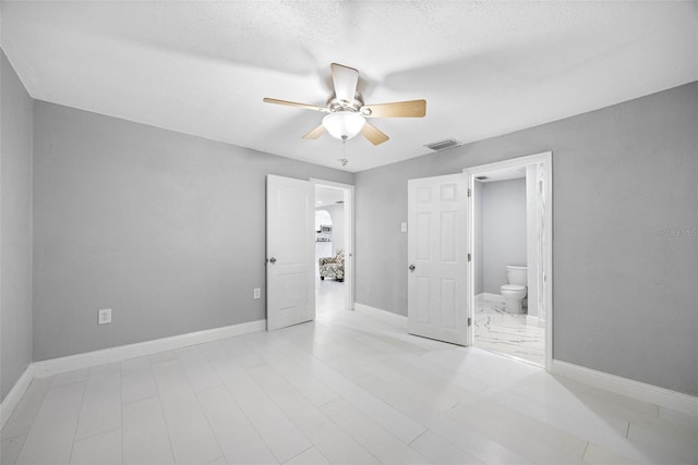 bedroom with visible vents, ensuite bath, baseboards, and a ceiling fan