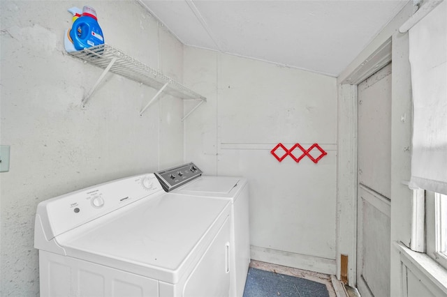washroom featuring washer and clothes dryer and laundry area