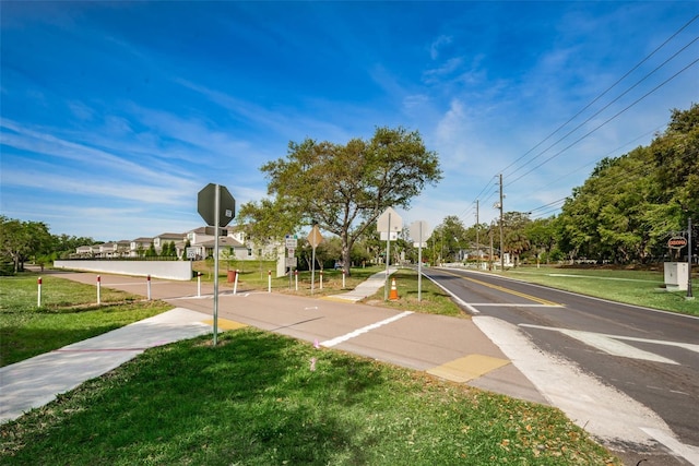 view of street with traffic signs and sidewalks