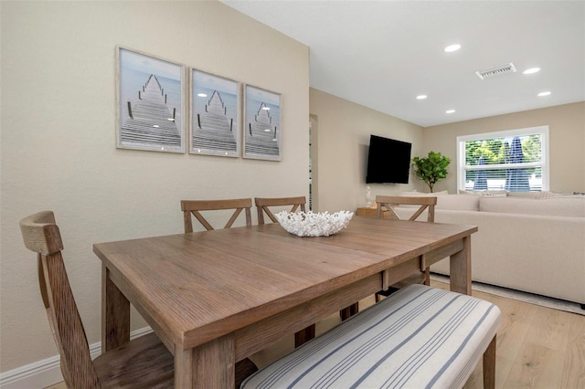 dining space featuring recessed lighting, light wood-style floors, and visible vents