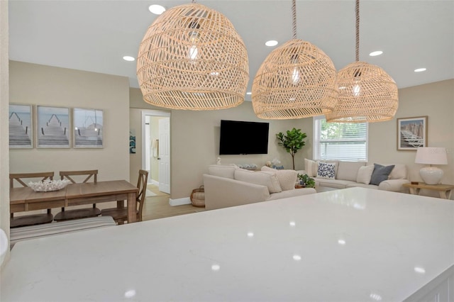 interior space featuring recessed lighting, light wood-type flooring, and baseboards