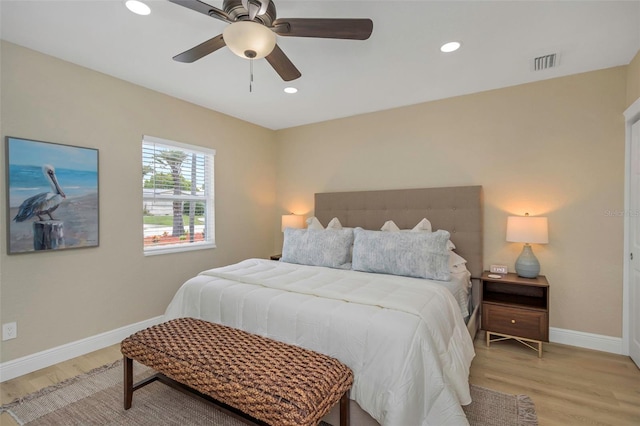 bedroom with light wood-type flooring, visible vents, baseboards, and recessed lighting