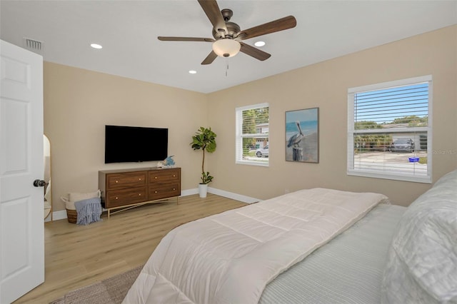 bedroom featuring visible vents, recessed lighting, baseboards, and wood finished floors