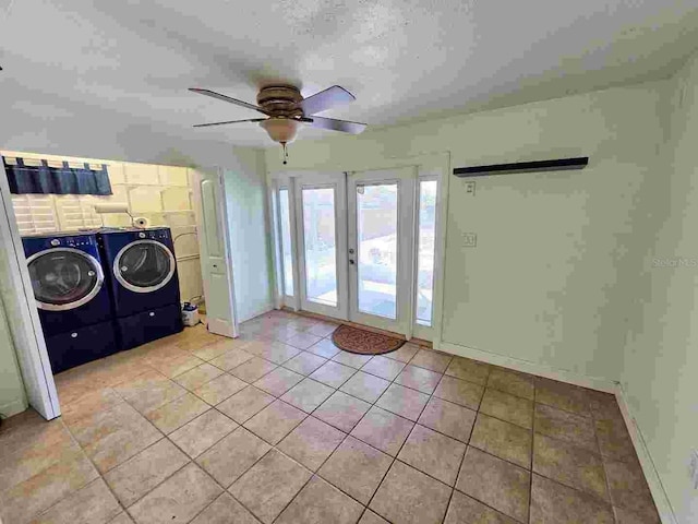 washroom with light tile patterned floors, laundry area, ceiling fan, french doors, and washing machine and dryer