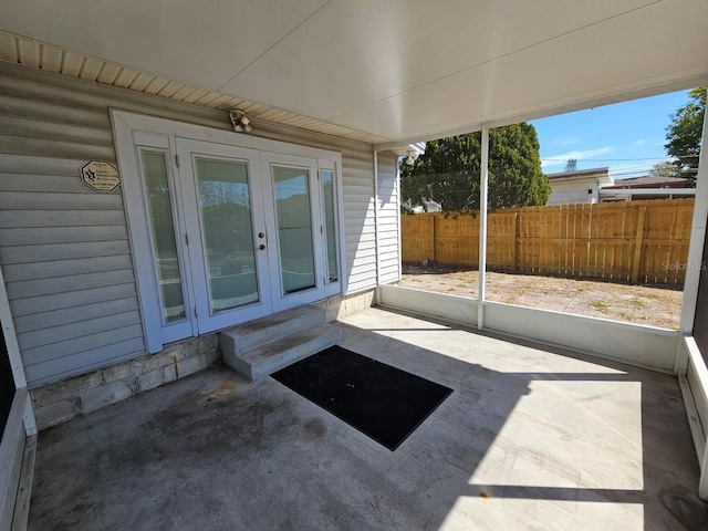 view of patio / terrace featuring french doors and fence