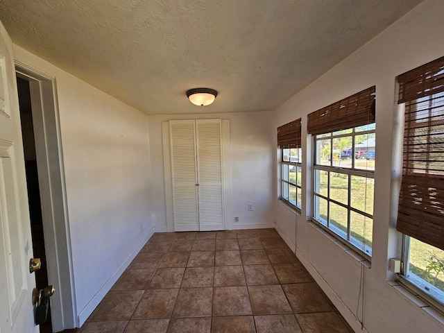 unfurnished sunroom featuring a healthy amount of sunlight