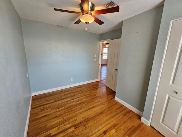 unfurnished bedroom with baseboards, visible vents, and light wood finished floors