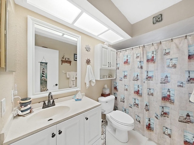 full bathroom with vanity, a shower with shower curtain, and toilet