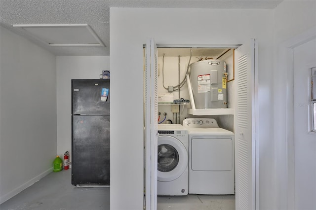 laundry room with a textured ceiling, water heater, baseboards, laundry area, and washing machine and clothes dryer