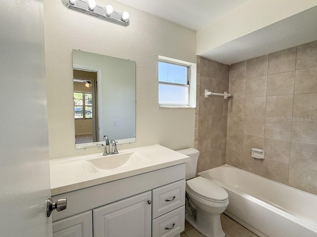 bathroom with shower / bathing tub combination, plenty of natural light, toilet, and vanity