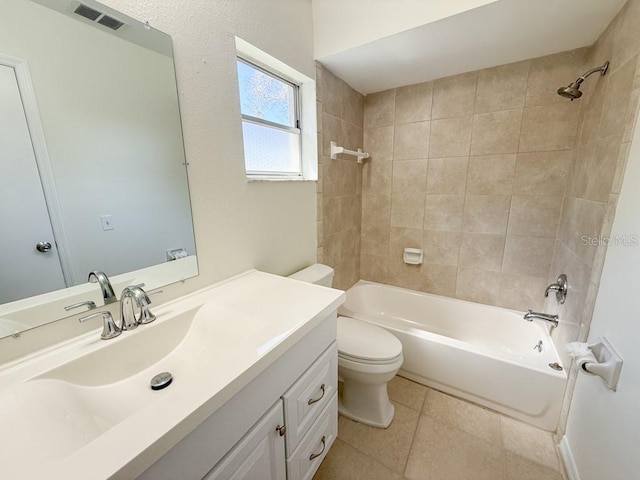 full bath featuring visible vents, washtub / shower combination, toilet, tile patterned floors, and vanity