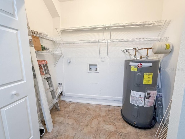 washroom with hookup for a washing machine, water heater, and laundry area