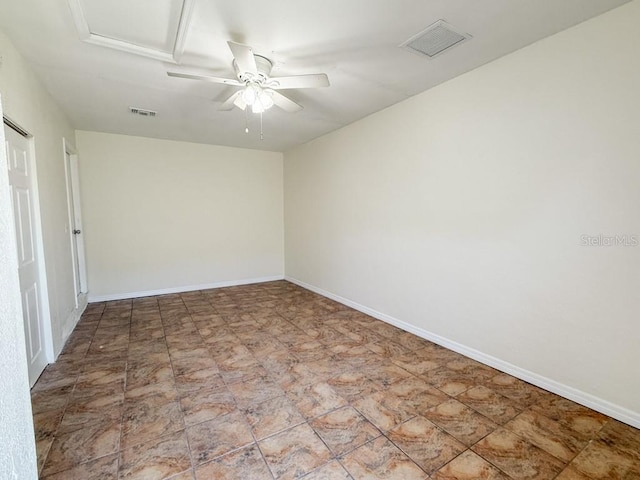 empty room featuring visible vents, baseboards, and attic access