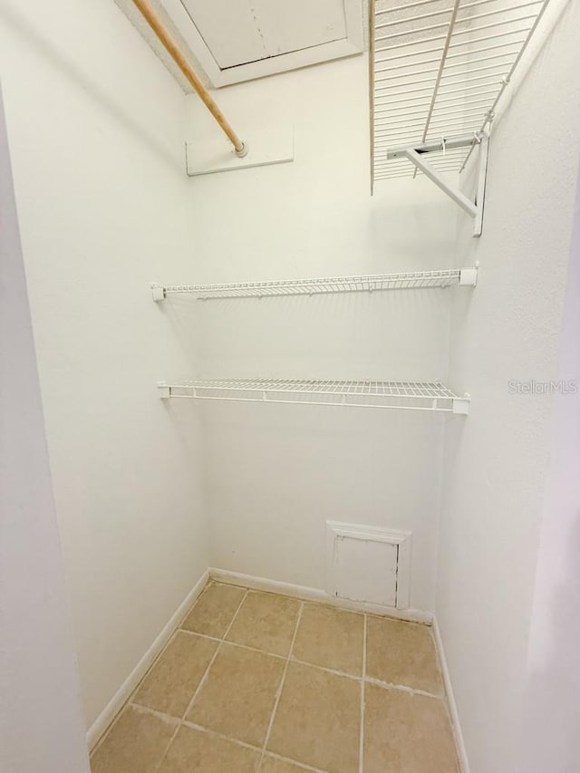 spacious closet with tile patterned flooring