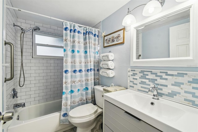 bathroom featuring backsplash, toilet, shower / bath combo, and vanity