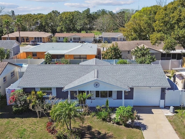 birds eye view of property with a residential view