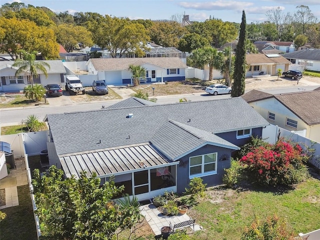 birds eye view of property with a residential view