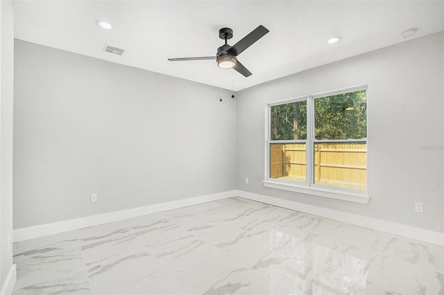 unfurnished room featuring recessed lighting, visible vents, baseboards, and marble finish floor