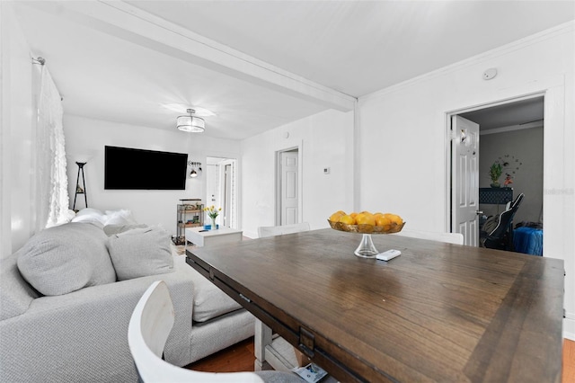 dining room featuring crown molding