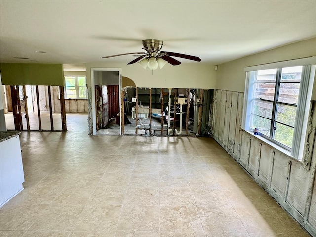 interior space featuring ceiling fan