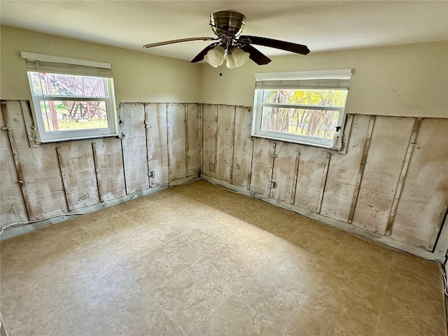 basement with ceiling fan