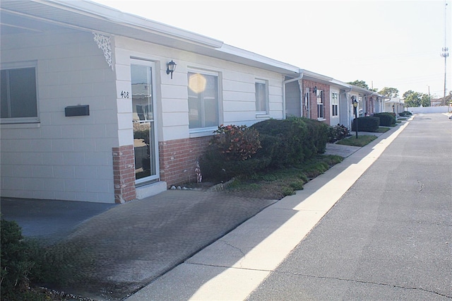 exterior space with brick siding