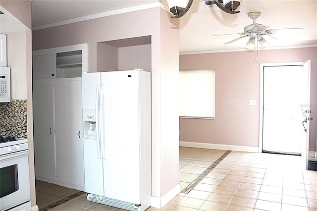 kitchen with tasteful backsplash, ornamental molding, light tile patterned floors, white appliances, and a ceiling fan