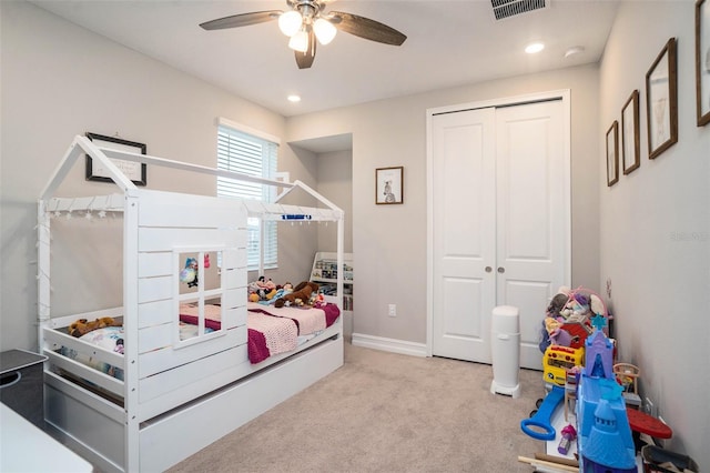 bedroom featuring carpet flooring, baseboards, visible vents, and a closet