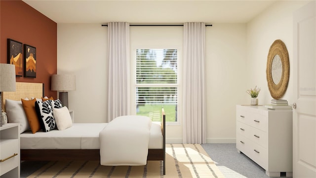 bedroom featuring light colored carpet and baseboards